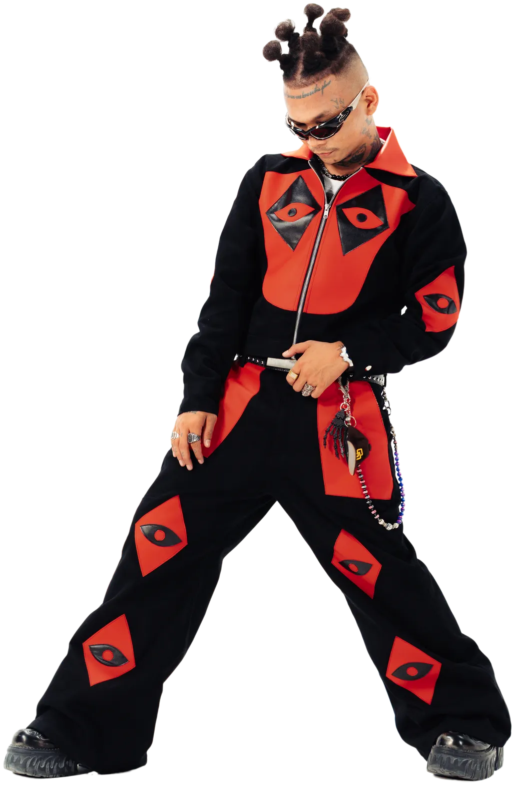 ST MAN standing full height in a black and red jumpsuit